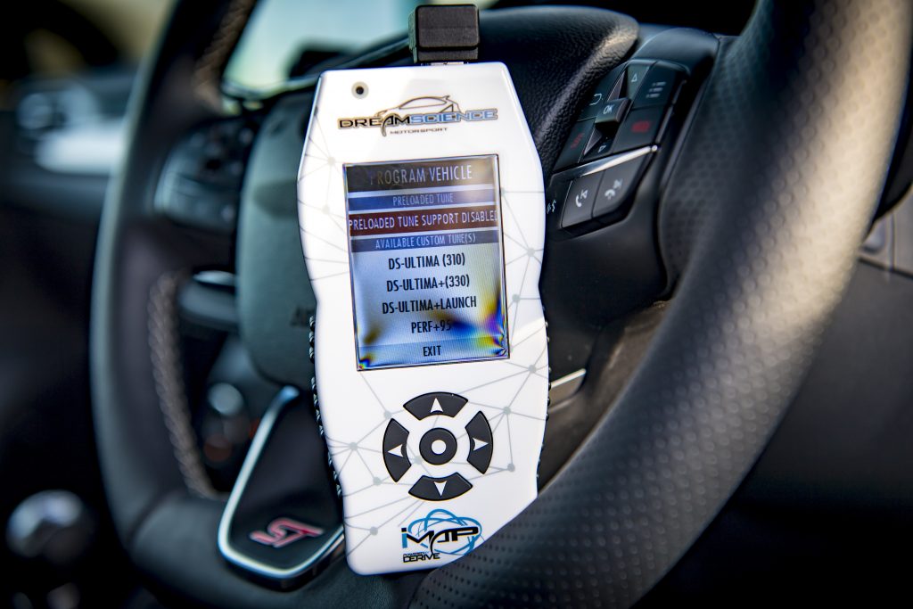Imap Tuning device powered on and leaning the steering wheel of a Focus ST MK4