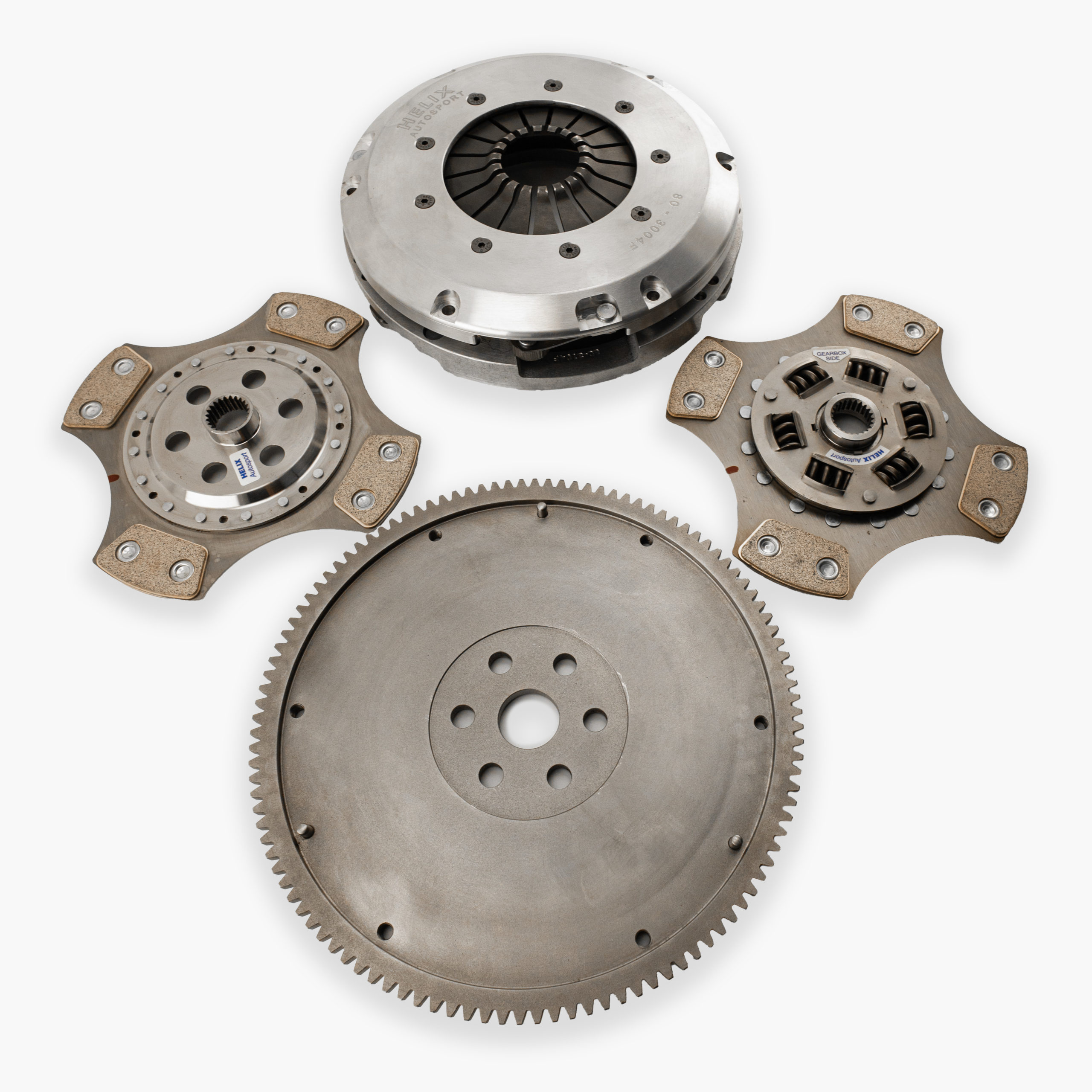 The image shows a stripped twin-plate clutch kit with flywheel on a white background